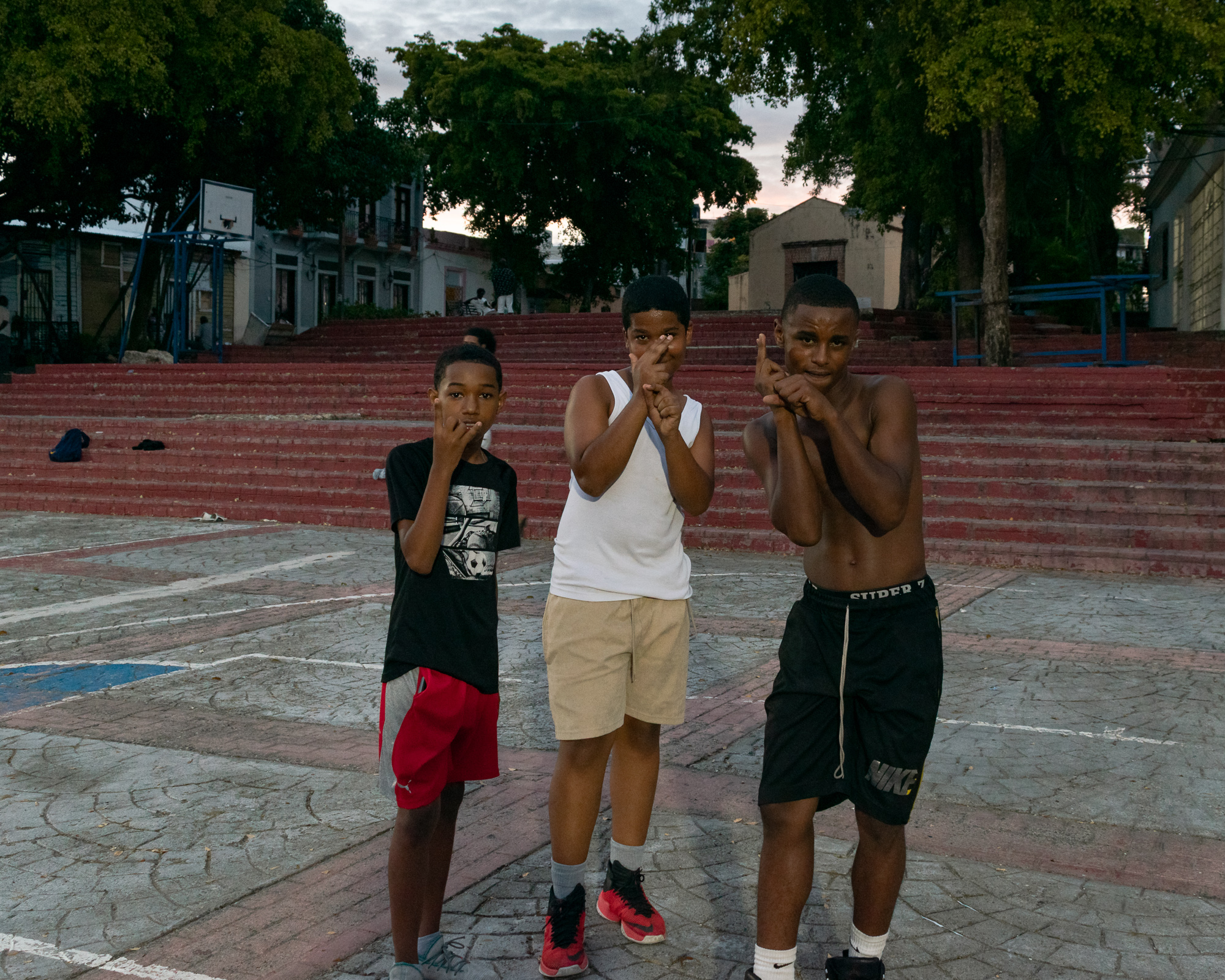 Boys in a Santo Domingo park — portrait, confidence shading into something more complex