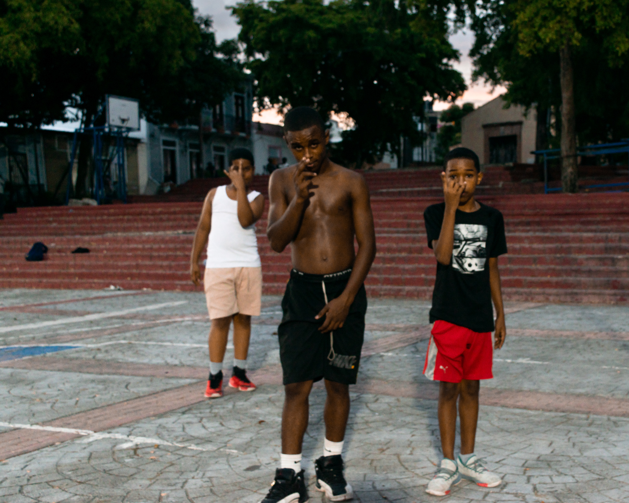 Boys in a Santo Domingo park — intimate, quiet, the most tender of the three