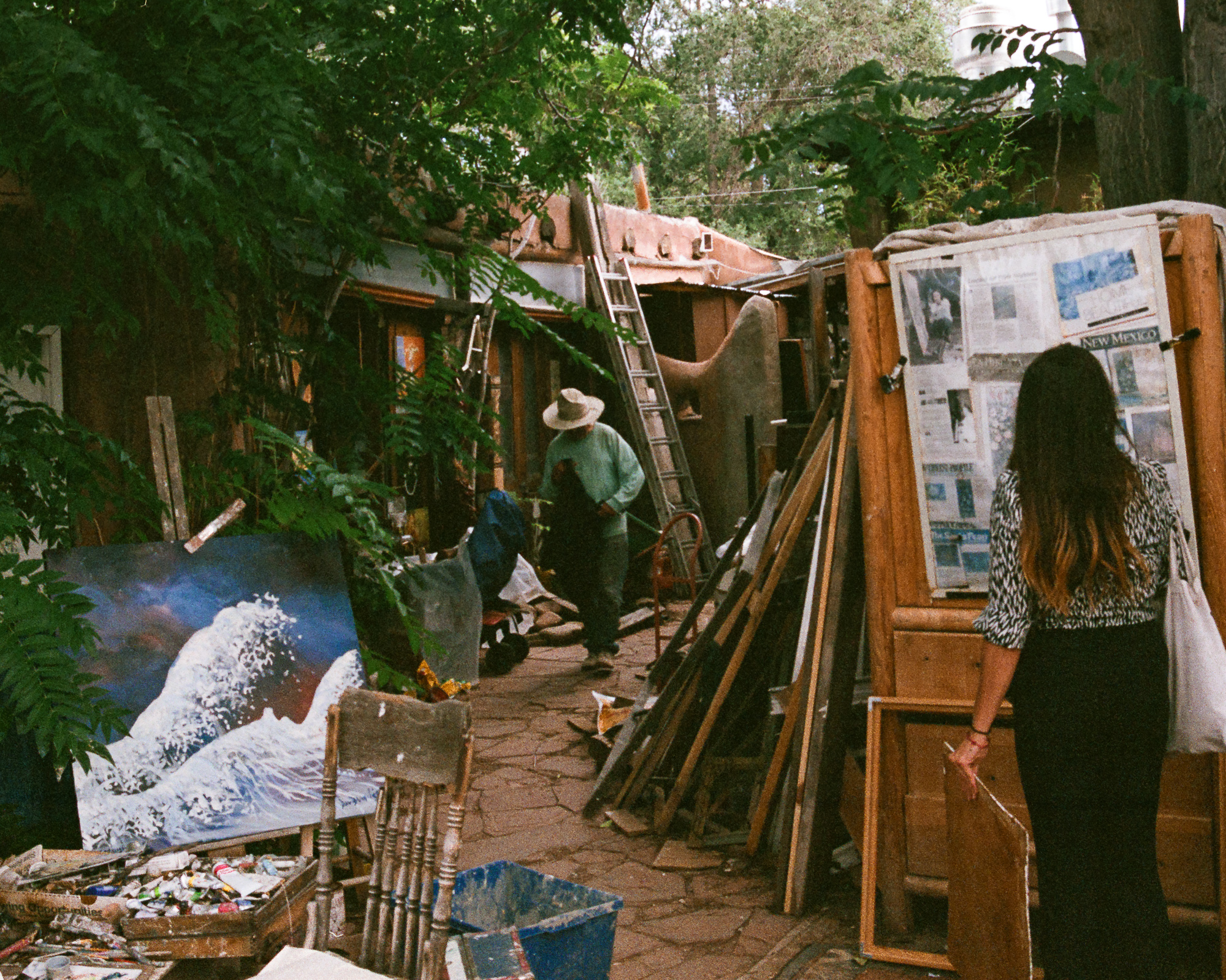 A garden studio with a painting visible, a sense of mystery and warm afternoon light — Santa Fe, color 35mm film