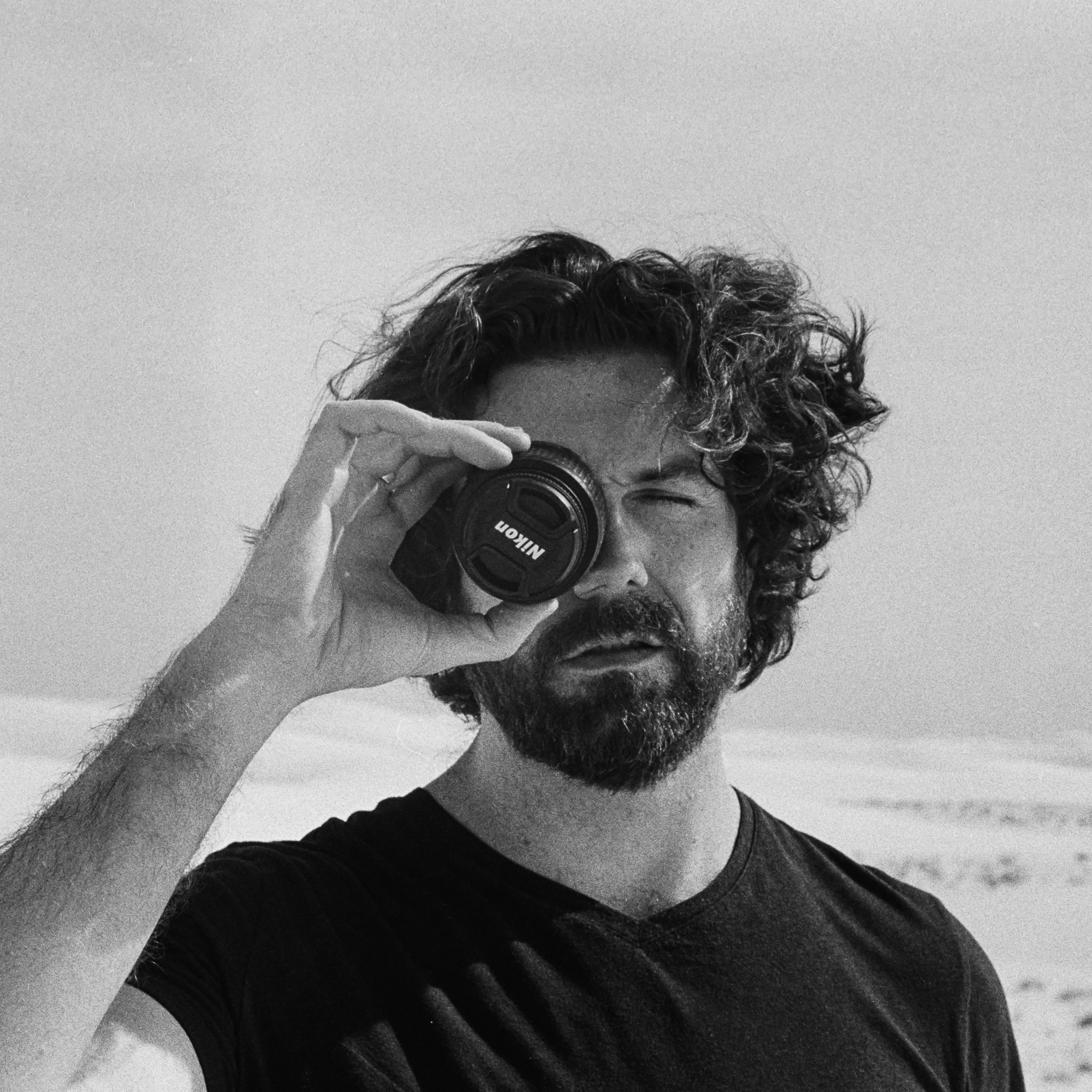 Self-portrait with Nikon lens cap, White Sands