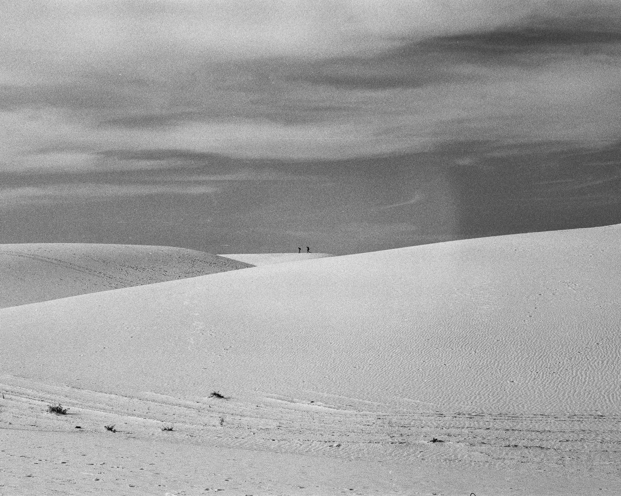 Two figures on White Sands dune ridge, 35mm film