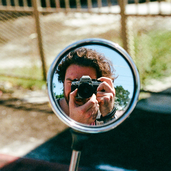 Seamus Dolan reflected in a mirror