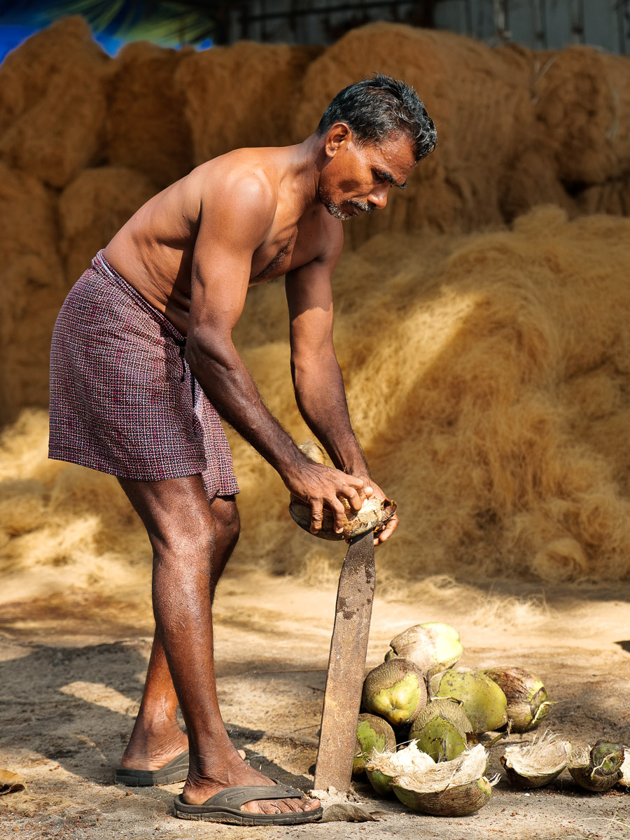 Artisan trimming mat edges, Kochi